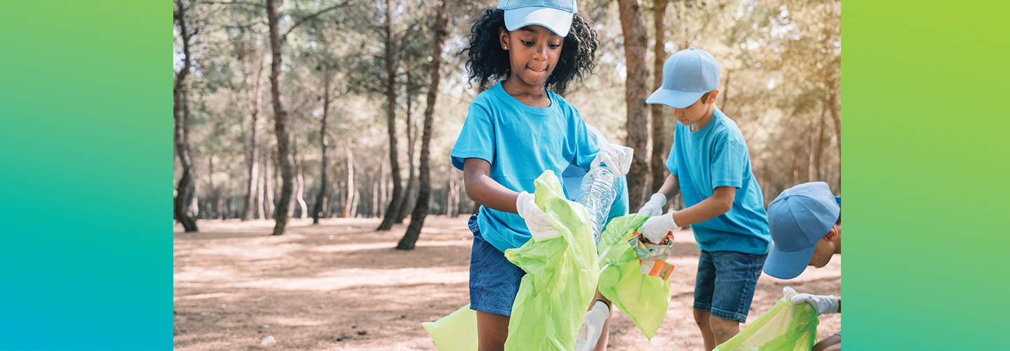 Photo of kids volunteering and picking up litter outside