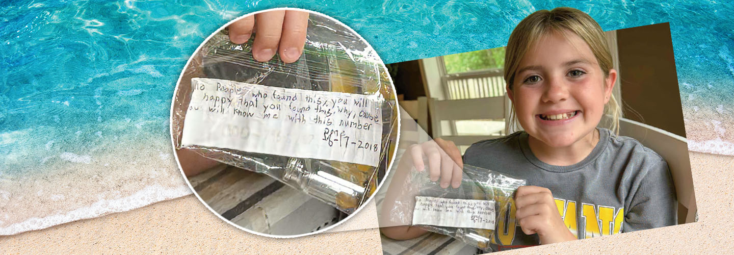 Image of a kid holding a found message in a bottle
